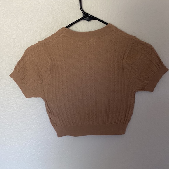 These tops are from fashion Q the black is a small and the tan is extra small. - Picture 8 of 8